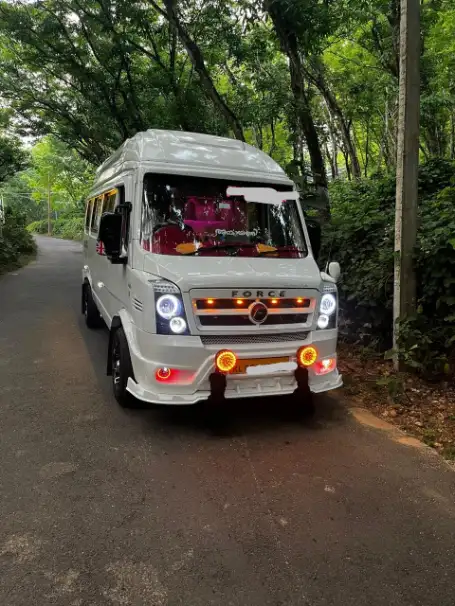 Tempo Traveller with scenic background